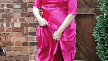 Hot sissy crossdresser outdoors in full length hot pink satin